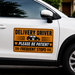 White car with a 'Delivery Driver Please Be Patient Frequent Stops' sign on the side.