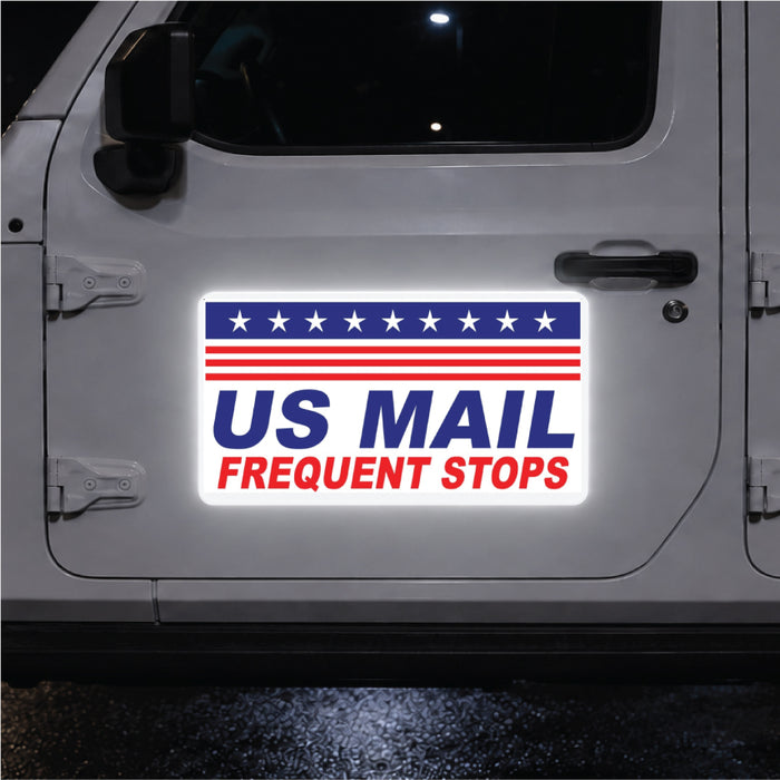 Car door with a 'US Mail Frequent Stops' reflective magnetic sign on a white background