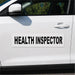 Car with 'HEALTH INSPECTOR' decal on a white background