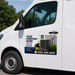HVAC vehicle magnet or sticker installed on white cargo van door advertising heating and cooling installation repair and maintenance services