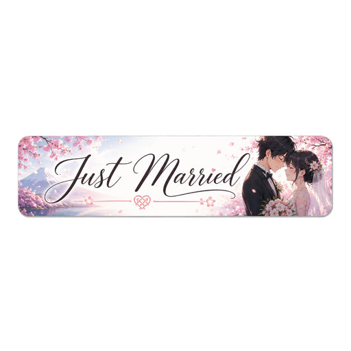 Decorative banner with 'Just Married' text and a couple embracing, set against a cherry blossom background.