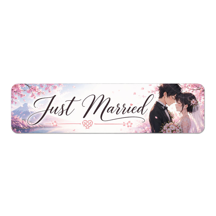Decorative banner with 'Just Married' text and a couple embracing, set against a cherry blossom background.