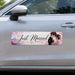Car with a 'Just Married' magnetic sign featuring an image of a couple.