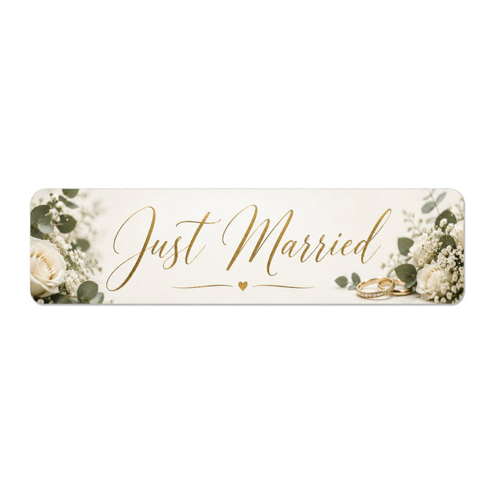 Decorative sign with 'Just Married' text and floral elements on a white background