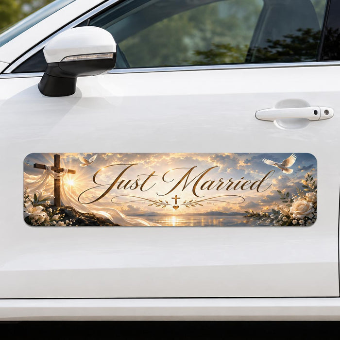 Car with a 'Just Married' decal featuring a cross and sunset design.