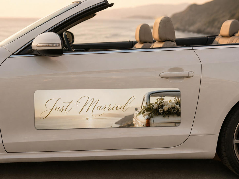 Car door with 'Just Married' sign and floral arrangement, beach in the background