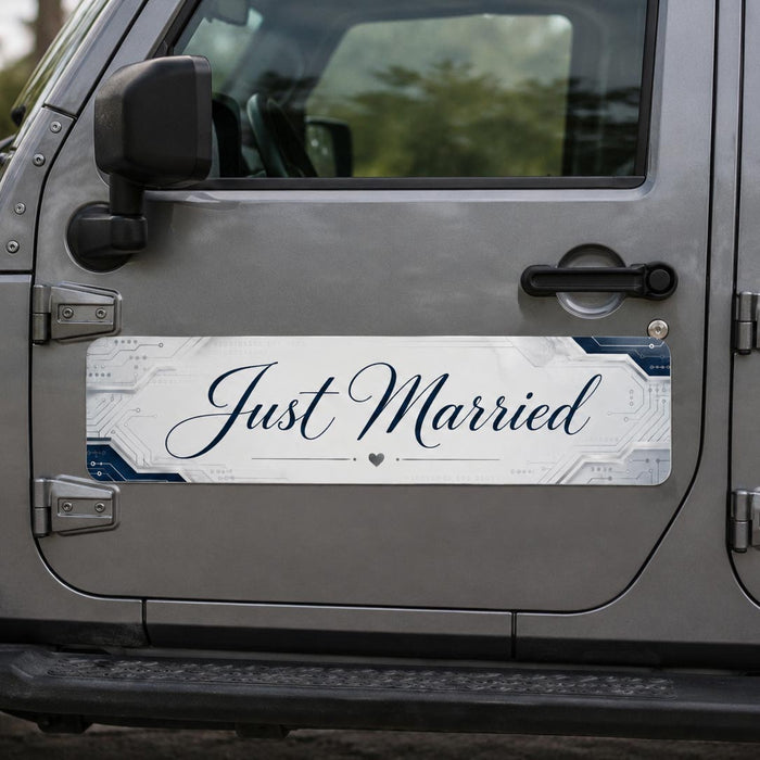 Car door with 'Just Married' sticker on a vehicle outdoors