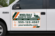 Custom lawn care vehicle sign with company name, phone number, website, mowing, mulch, and landscaping services