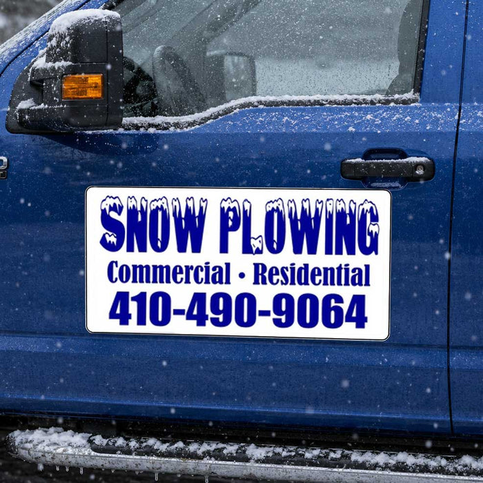 snow plowing magnetic sign with blue lettering on a blue truck. 