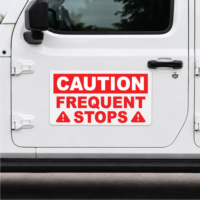 White vehicle door with a red and white caution frequent stops magnetic sign.