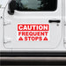 White vehicle door with a red and white caution frequent stops magnetic sign.