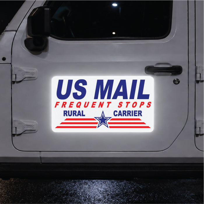 Reflective US Mail magnetic sign on a vehicle door at night