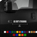 Black vehicle with US DOT certification label and color swatches at the bottom.