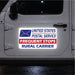 United States Postal Service sticker on a vehicle door