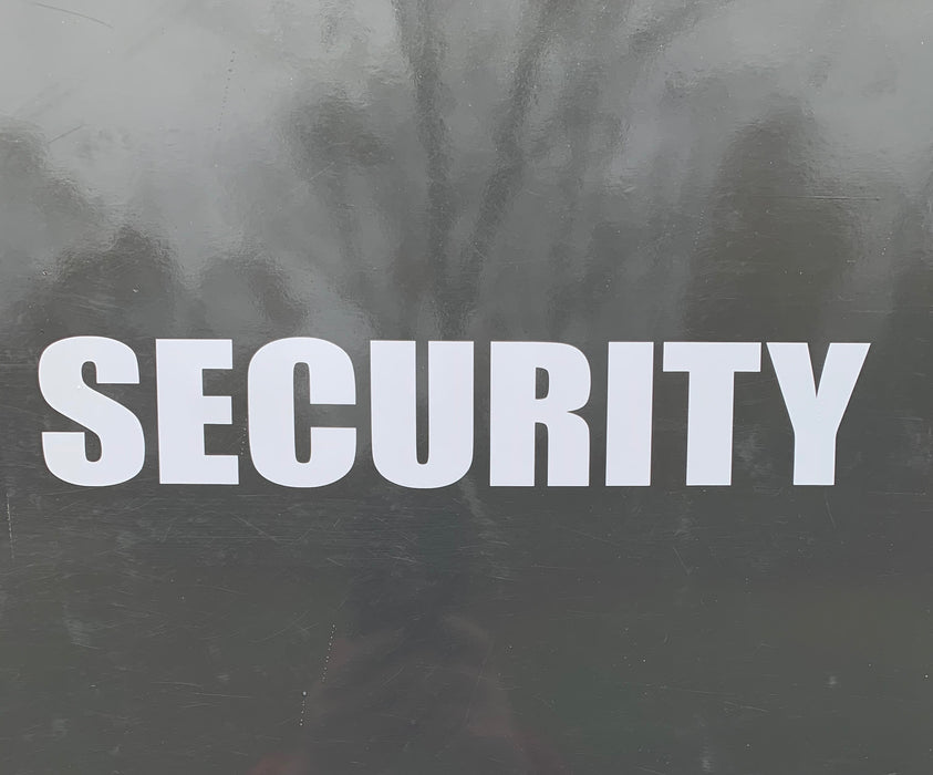 White 2" tall SECURITY Sticker installed on a Truck